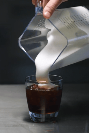 AirWhip Frothing Jar pouring cold foam