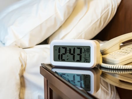 Bedside alarm clock in hotel room