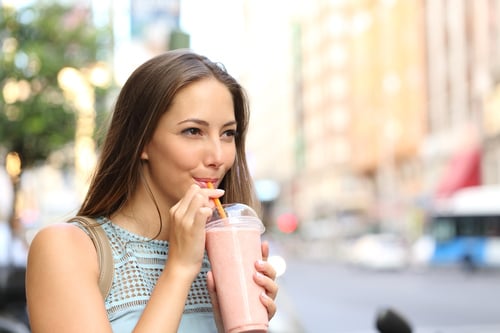 Young Woman Enjoying a Smoothie